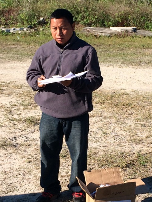 Oscar prepares to facilitate an education session for farmworkers in the tomato fields near Immokalee.