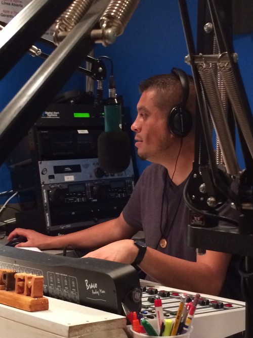 Gerardo speaks to farmworkers on his daily radio show on Radio Tuyo.