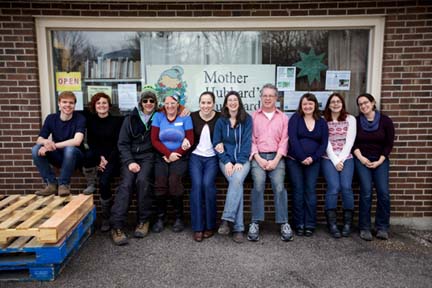 MHC staff in front of the organization’s food pantry. Photo by Josh Franer.