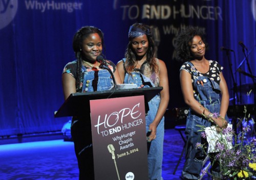 Youth from WhyHunger partners EcoStation:NY in Brooklyn give a special keynote address at the 2014 WhyHunger Chapin Awards, “Hope to End Hunger,” at Hard Rock Cafe New York in Times Square. A farm constructed by EcoStation:NY was a feature at the event. From left to right: Iyeshima Harris, Benia Darius, Kristina Erksine