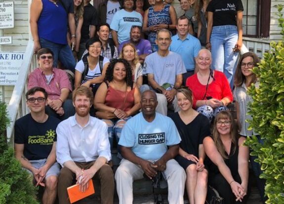 CTHG attendees at a conf fieldtrip, caption: Conference attendees on a field trip to then Field Green Duke House of Soul City exploring Economic and Environmental Resilience and Innovation. Photo courtesy of CTHG's Facebook Page