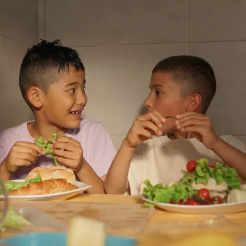 Kids eating salad