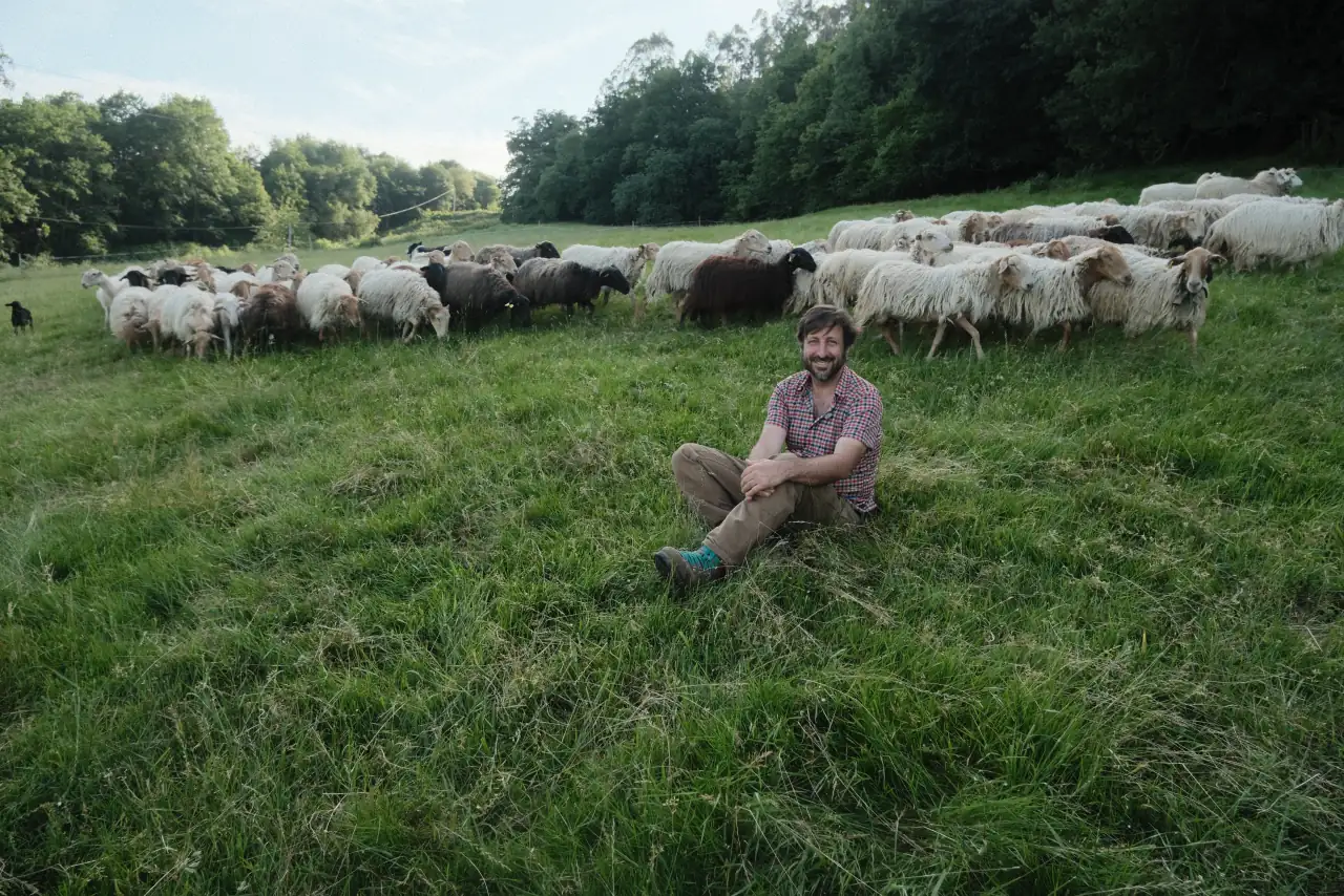 School Coordinator, Fernando Dory, in the school’s pasture with sheep. Photo Credit: Melanie Marques